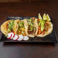 Chicken Taco (Order of 3) · Tacos topped with fresh onions and cilantro, garnish with a lime wedge and, radish, accompan...