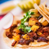 Al Pastor Taco (Order of 3) · Marinated pork with grilled pineapple and onions. Tacos topped with fresh onions and cilantr...
