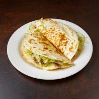 Birria Quesadilla · Two warm grilled flour tortillas filled with cheese, fresh lettuce, Cotija powder cheese, an...