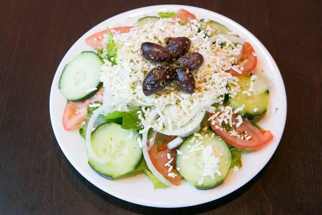 GREEK SALAD · Romaine, tomatoes, cucumbers, onions, feta cheese, and olives.