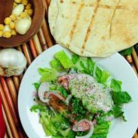 HOUSE SALAD · Romaine, tomatoes, cucumbers, onions, and house garlic vinaigrette.