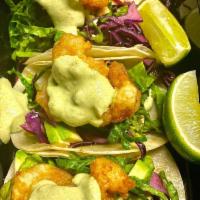 Baja Shrimp Taco (Not Available Sat + Sun before 4pm) · Battered shrimp, mini flour tortillas, chipotle aioli, jicama slaw, avocado crema, micro cil...