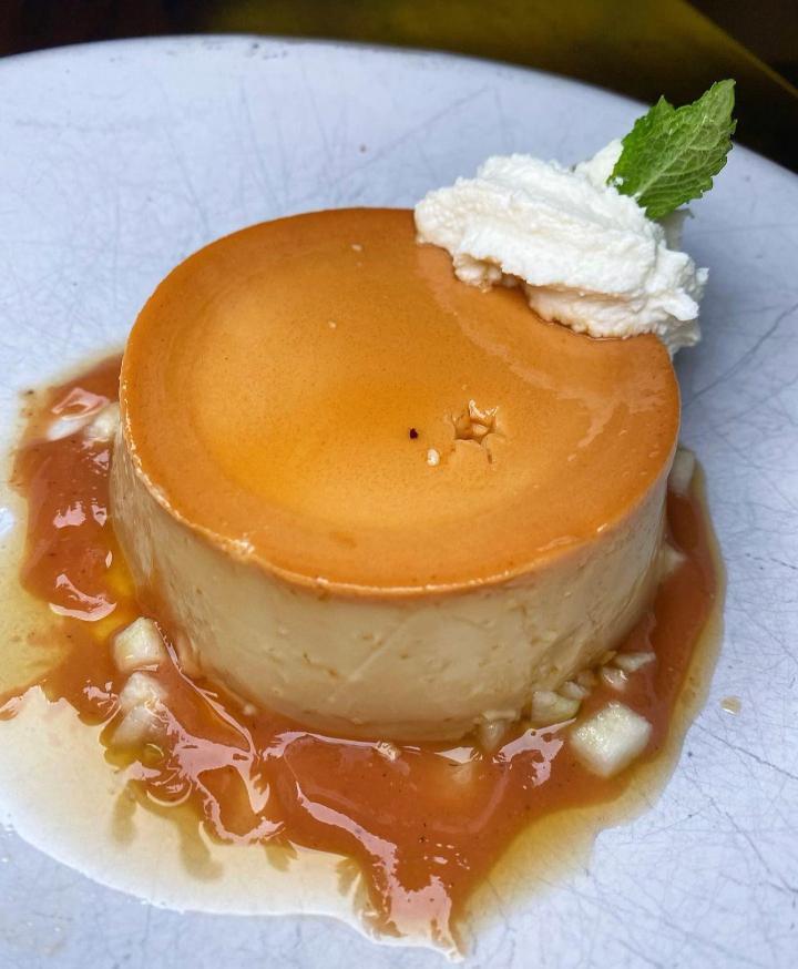 Guava Flan · Cream cheese caramel custard, pineapple brulee, sprinkled with toasted coconut flakes