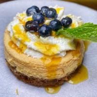 Passion Fruit Cheesecake · Passion fruit cheesecake, maracuya gelee, blueberries, mint.