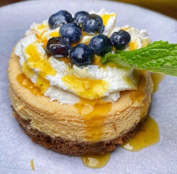 Passion Fruit Cheesecake · Passion fruit cheesecake, maracuya gelee, blueberries, mint.