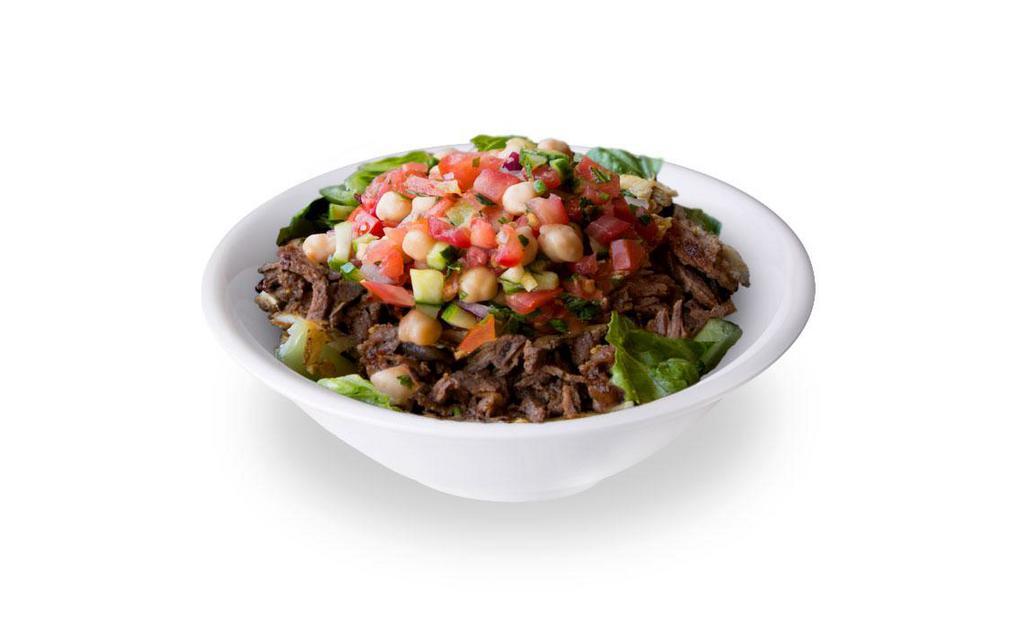 Beef Shawarma Bowl · Rice, lettuce, garbanzo salad and dressing.