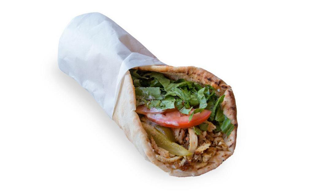 Chicken Shawarma Wrap · Chicken Shawarma , Pita Bread , Lettuce , Tomato, Pickles & Garlic Sauce 