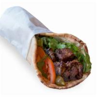 Beef Kabob Wrap · Beef kabob, pita bread, lettuce, grilled tomato, grilled onions and tahini sauce.