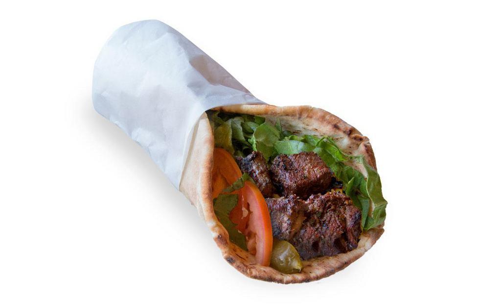 Beef Kabob Wrap · Beef kabob, pita bread, lettuce, grilled tomato, grilled onions and tahini sauce.