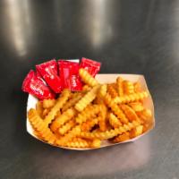 Crinkle Cut Fries · Golden crinkle cut french fries fried crisp with ketchup on the side, served as a half pound...