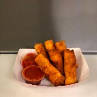 Pizza Logs · Cheese and pepperoni rolled up into an egg roll and deep fried for a light tasty crunch, ser...