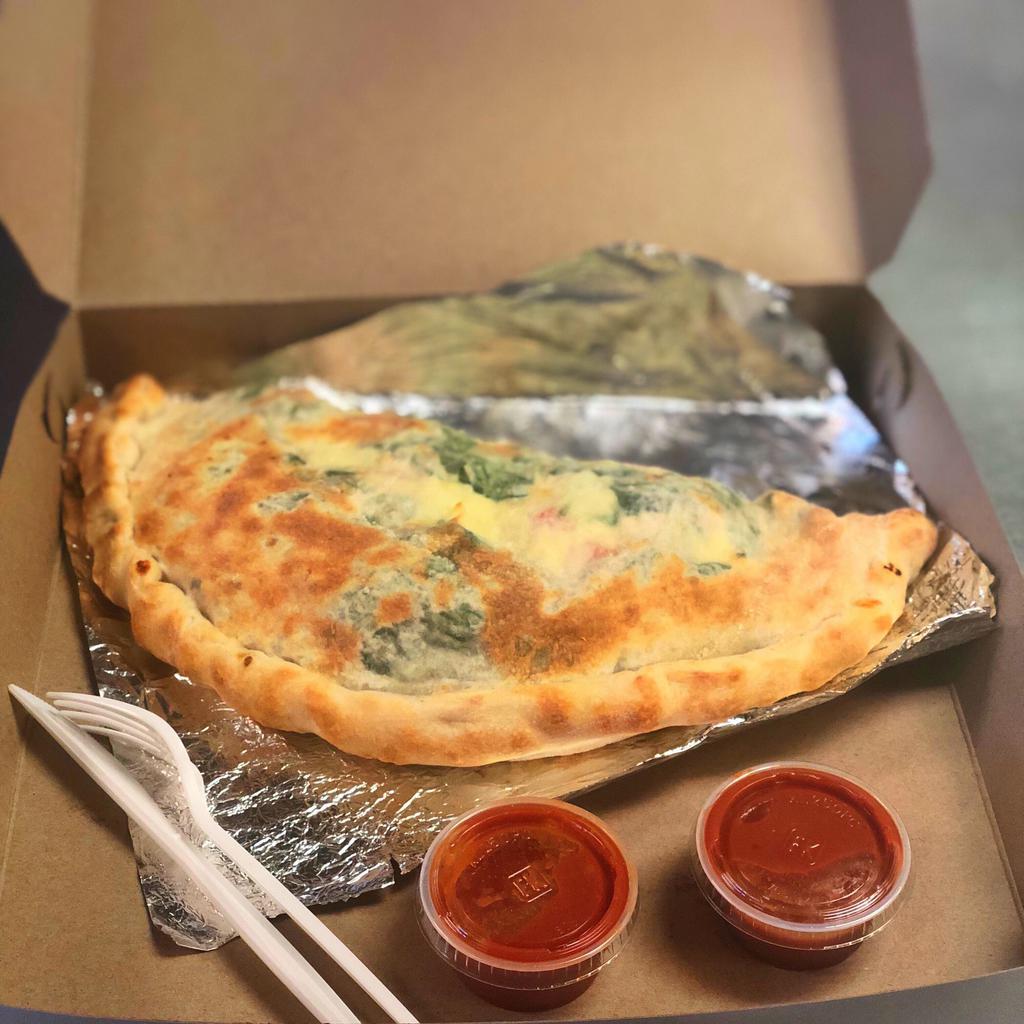 Calzone · A large pocket of dough, stuffed with New York style ricotta and mozzarella cheeses then stuff it with your choice of delicious toppings served with marinara on the side.