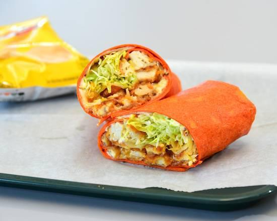Buffalo Chicken Wrap · A local Favorite crispy chicken tenders served in our tomato basil wrap dressed our house made medium sauce and Ken's Buffalo bleu cheese, provolone cheese, and lettuce then dress it up with your choice of additional veggies!