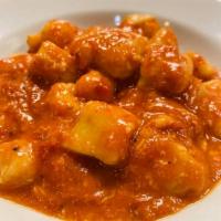 Gnocchi alla Napoletana · Homemade gnocchi in tomato sauce, mozzarella and fresh basil.