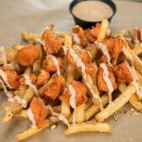 Native Buffalo Fries · Our signature seasoned fries topped with chopped chicken strippers tossed in our medium wing...