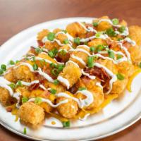 Loaded Tots · You gonna eat your tots? We serve 'em nice and crispy with cheddar jack cheese, bacon, sour ...