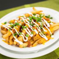 Loaded Fries · Large portion of our signature seasoned fries with cheddar Jack cheese, bacon, sour cream an...