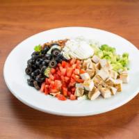 Cobb Salad · A tower of fresh greens topped with diced grilled chicken, crumbled bleu cheese, bacon crumb...