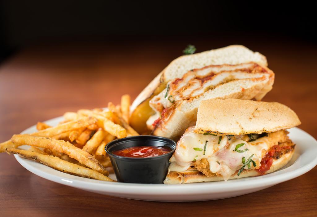 Chicken Parm Sandwich · Tender, battered chicken nestled into a hoagie, smothered in mozzarella, Parmesan, marinara sauce, and fresh basil. Served with our signature seasoned fries.