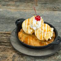 Native White Chocolate Macadamia Nut Cookie Sundae · Served with vanilla ice cream, whipped cream, caramel and a cherry on top.