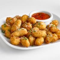 Cheese Curds · Wisconsin cheese curds lightly battered and fried to golden perfection. Served with a side o...
