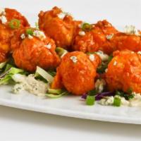 Buffalo Cauliflower · Lightly battered and fried cauliflower florets tossed in our buffalo sauce on a bed of bleu ...