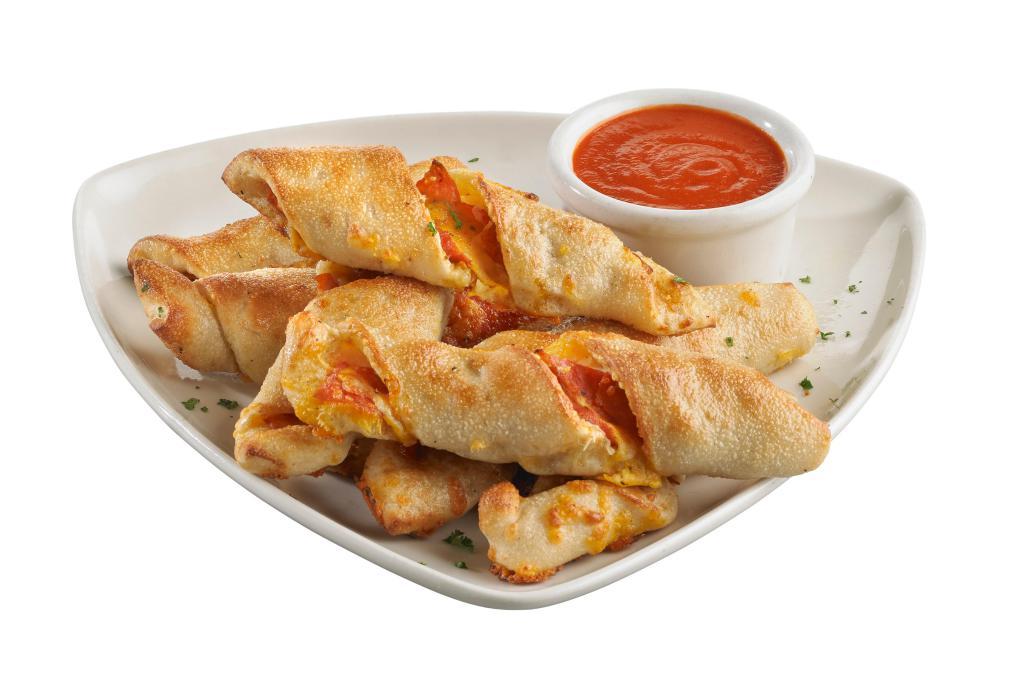 Pepperoni Stuffed Twist Bread · Our hand-pressed pizza dough stuffed with sliced pepperoni, cheddar, mozzarella and Parmesan cheeses, twisted then baked to perfection. Served with our signature pomodoro sauce for dipping.