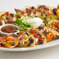 Boston's Nachos · Serves 3-4. Our signature half flour, half corn tortilla chips, individually topped with che...