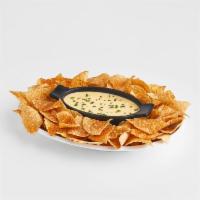 Chips and Queso · Boston's rich queso served with freshly fried and seasoned corn chips. 