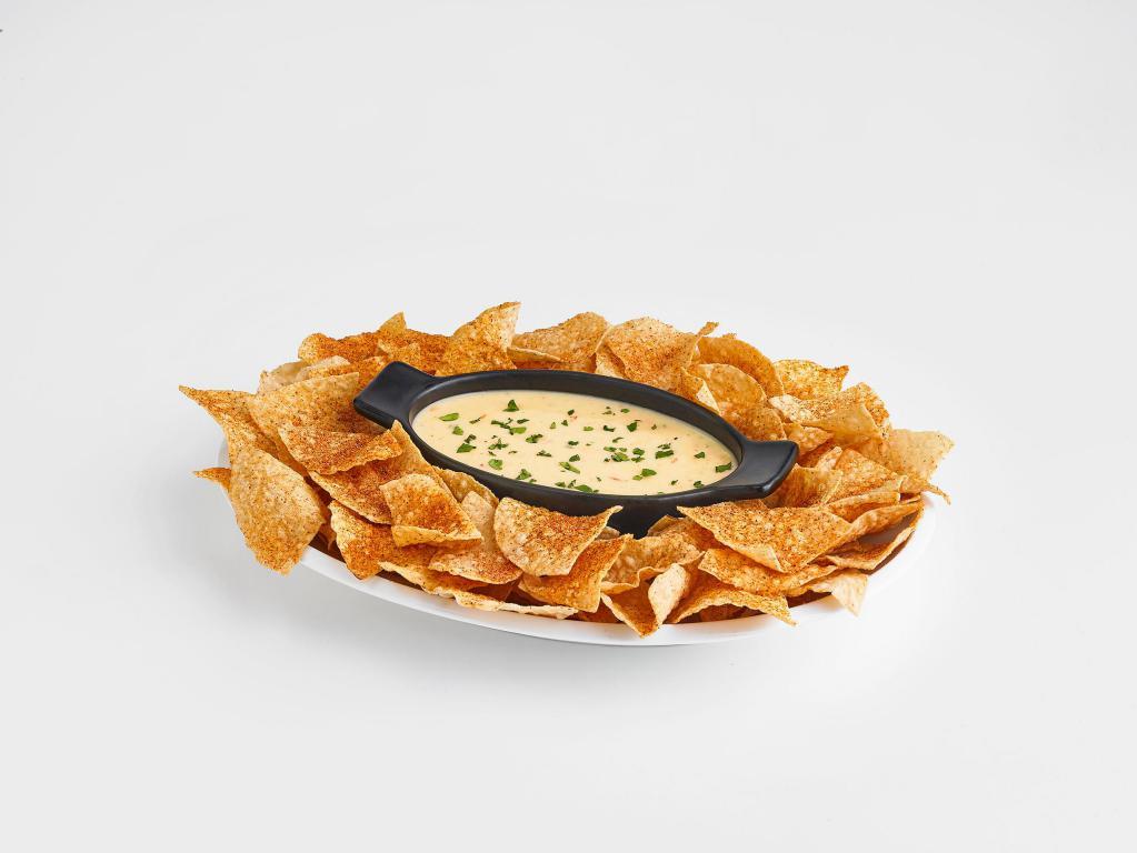 Chips and Queso · Boston's rich queso served with freshly fried and seasoned corn chips. 