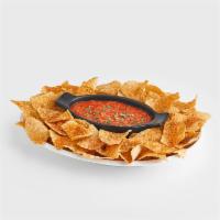 Chips & Salsa · Our made from scratch salsa served with our freshly fried and seasoned corn chips.