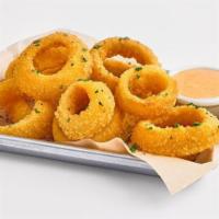 Onion Rings · Lightly battered and fried onion rings, served with a side of roasted red pepper aioli.