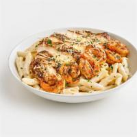 Chicken and Shrimp Pasta · Grilled chicken breast and Cajun shrimp over penne pasta tossed in a creamy Alfredo sauce an...