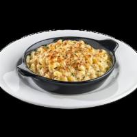 Twisted Mac & Cheese · Spiral pasta tossed in rich queso, made with cheddar cheese and creamy Alfredo sauce, topped...