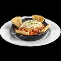 Baked Lasagna · A hearty classic, made in-house, featuring layers of pasta filled with ground beef and ricot...