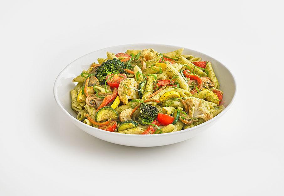 Veggie Pesto Pasta · Penne pasta mixed with an array of seasonal vegetables, tossed in pesto sauce. Topped with fresh basil.