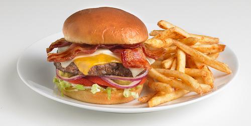 The MVB ( Most Valuable Burger) · American Choice Angus Beef, loaded with cheddar and mozzarella cheeses and crispy bacon. Includes lettuce, tomatoes, red onions, pickles, and mayonnaise on a toasted bun. Served with seasoned french fries.