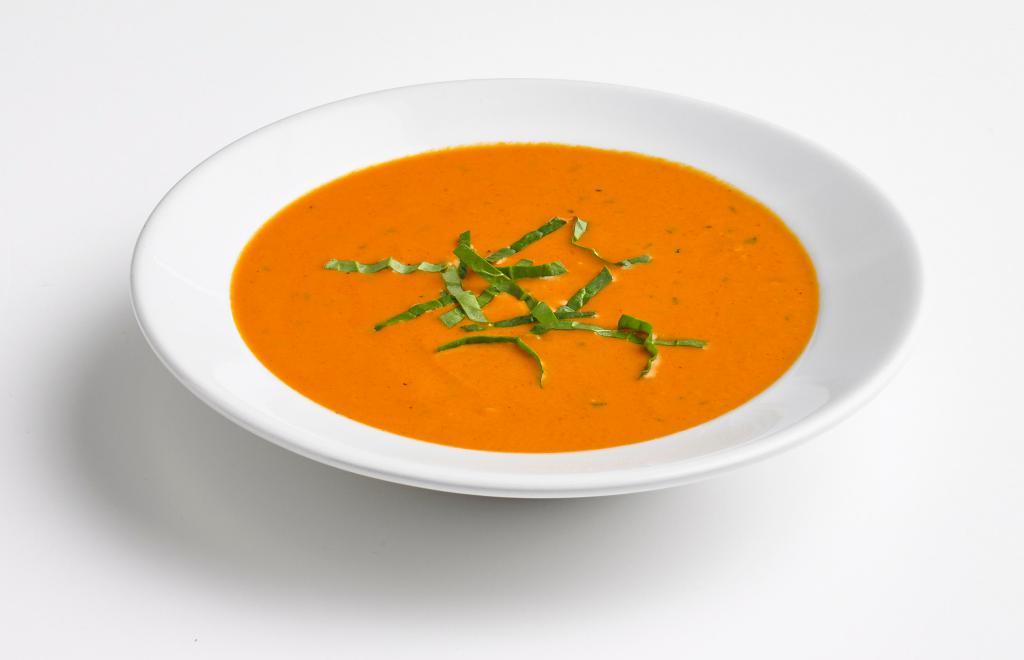 Tomato Basil Soup · A delicious medley of tomatoes, cream, spices, and garlic simmered in a rich broth.
