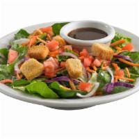 House Starter Salad · Spring mix with red onions, diced tomatoes, shredded carrots and savory croutons. Served wit...