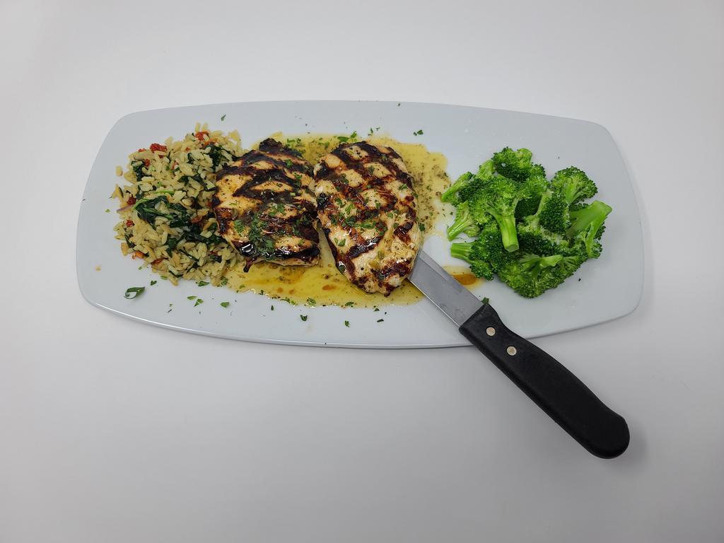 Grilled Chicken Lemonata · Lemony grilled chicken breast served with broccoli and house-made Florentine rice.