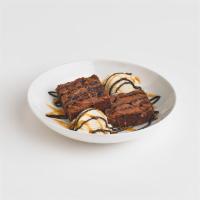 Chocolate Brownie Addiction · Two deluxe brownies served with vanilla ice cream and generously drizzled with chocolate sau...
