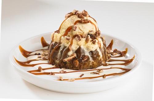 Boston's Whiskey Cake · This scrumptious sticky toffee pudding cake is surrounded by a decadent whiskey butter sauce and topped with vanilla ice cream. Then it's drizzled in caramel sauce and sprinkled with candied pecans.