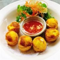 Crab rangoon · Crab meat and cheese wrapped with crispy wonton which served with homemade-thai sweet chilI ...