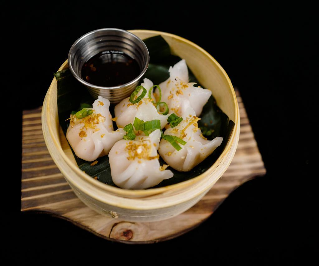 Steam shrimp dumpling · Steam shrimp dumpling topped with crunchy garlic ,served with soy vinaigrette