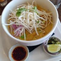 Kow Soi · Chicken. Northern Thai-inspired curry soup of herb flavor, shallots, garlic, cilantro, turme...