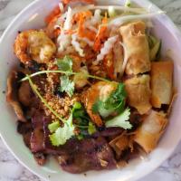 B1. Vermicelli with Grill Pork, Grill Shrimp, and Spring Roll · Rice noodle bowl with lettuce, thin slices of cucumbers, pickle and daikon and top with your...