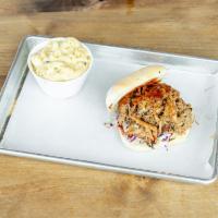 Pulled Pork Sammy · Slow smoked pulled pork, topped with house made slaw and a dab of our special honey BBQ sauce.
