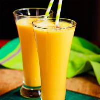 Mango lassi · Yogurt drink with mango and sugar.