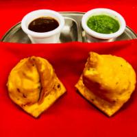 Vegetable samosa  · Mashed potatoes green peas with spices wrapped in home made pastry dough and deep fried to g...