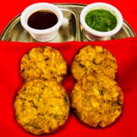 Aloo Tikki (vegan) · Mashed potato marinated in chickpeas flour sauce and fried to golden perfection.